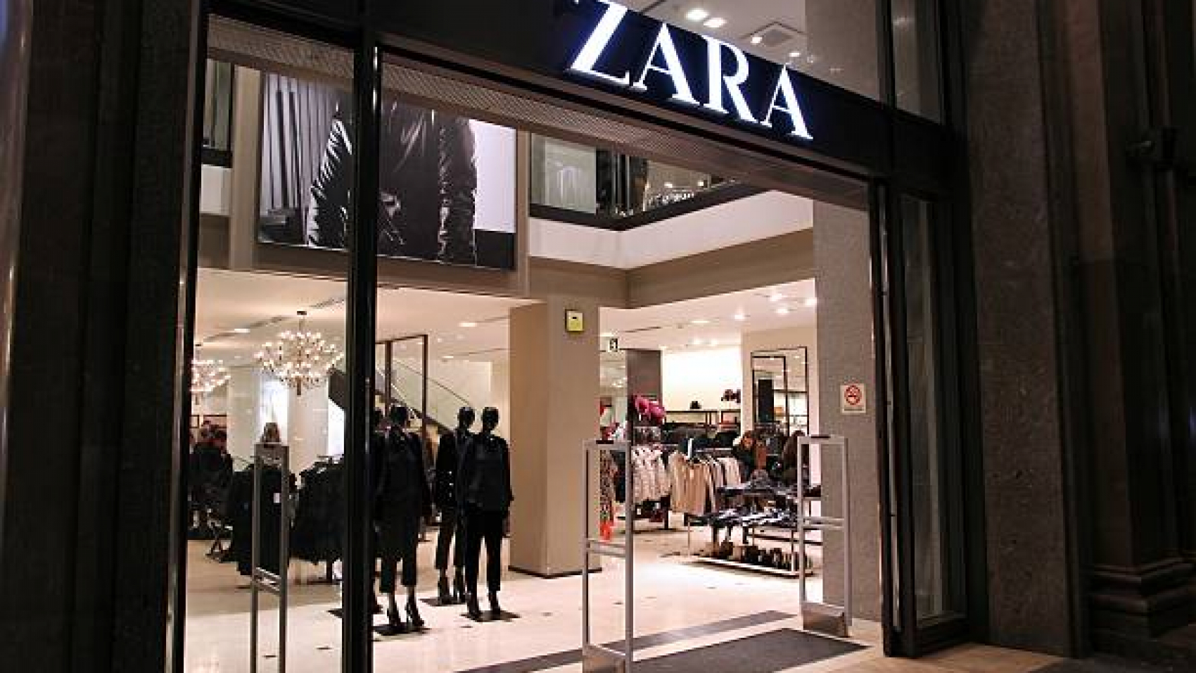 Barcelona, Spain - November 5, 2012: People visit Zara store on November 5, 2012 in Barcelona, Spain. Zara has 1,763 stores and had more than 7 billion EUR revenue in 2009.